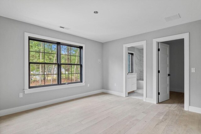 bathroom featuring vanity, an enclosed shower, and ornamental molding