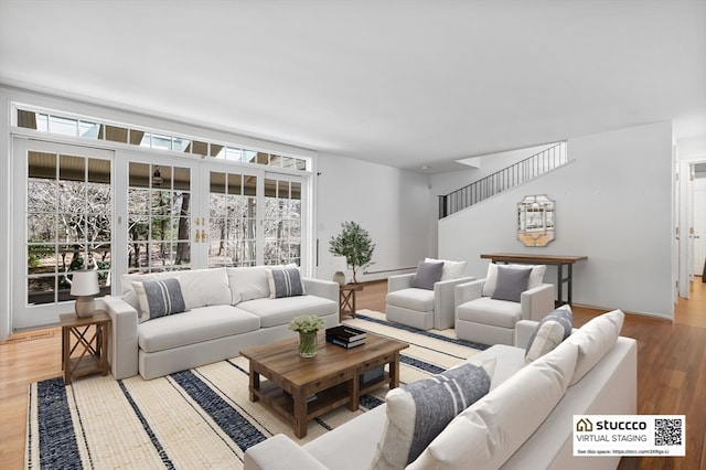 living room featuring plenty of natural light and light wood-type flooring