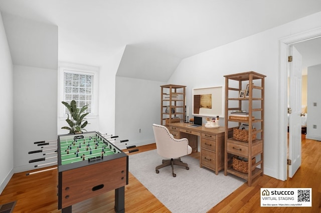 office area with lofted ceiling and light wood-type flooring