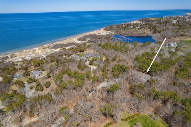 drone / aerial view with a water view and a beach view