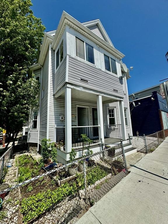 437 Ferry St Unit 1, Everett, MA 02149 - view of front of property with covered porch