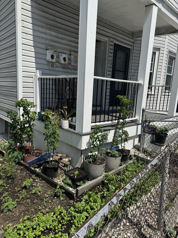 437 Ferry St Unit 1, Everett, MA 02149 - view of property exterior with covered porch