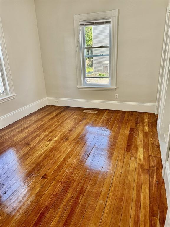 437 Ferry St Unit 1, Everett, MA 02149 - empty room featuring hardwood / wood-style flooring and baseboards