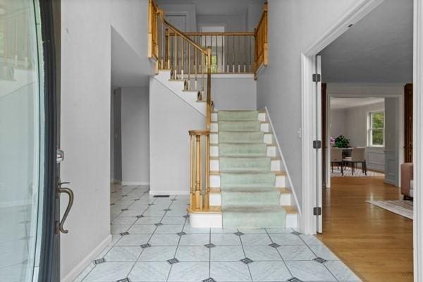 32 Twin Pond Ln, Sudbury, MA 01776 - entrance foyer featuring stairs and baseboards