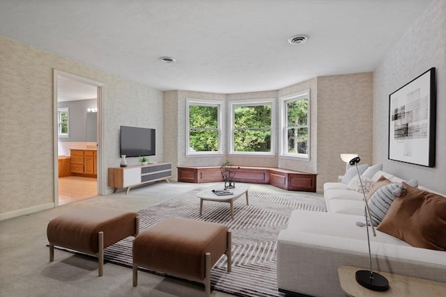32 Twin Pond Ln, Sudbury, MA 01776 - living area featuring healthy amount of natural light, light carpet, and wallpapered walls