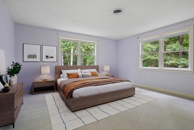 32 Twin Pond Ln, Sudbury, MA 01776 - bedroom with multiple windows and light colored carpet