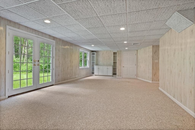 32 Twin Pond Ln, Sudbury, MA 01776 - empty room featuring carpet, wooden walls, recessed lighting, and french doors
