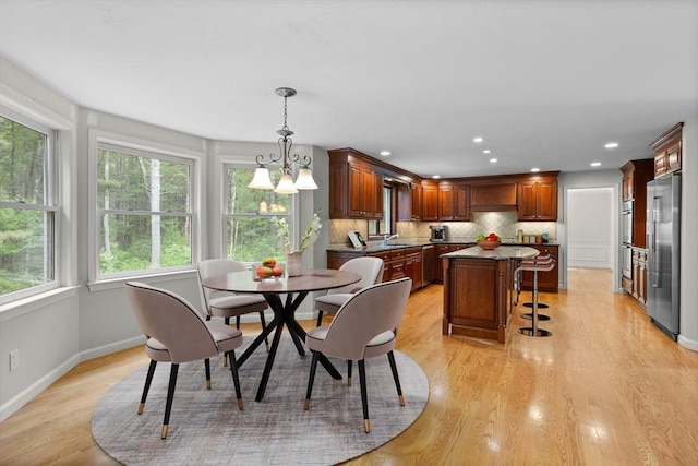 32 Twin Pond Ln, Sudbury, MA 01776 - dining space featuring light wood-style flooring, recessed lighting, and a chandelier