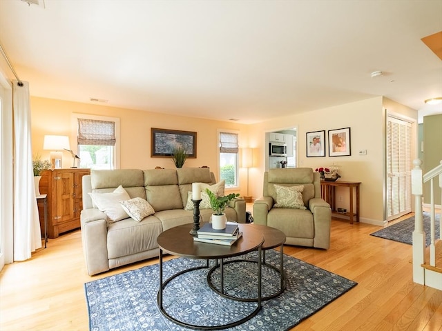 40 Bay Farm Unit 40, Duxbury, MA 02332 - living room featuring light wood-type flooring and stairway