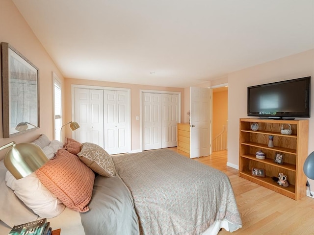 40 Bay Farm Unit 40, Duxbury, MA 02332 - bedroom featuring multiple closets and light wood-style flooring