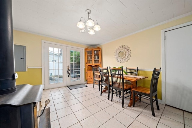 24 Hobson St, Brockton, MA 02302 - dining space featuring french doors, a chandelier, light tile patterned flooring, ornamental molding, and a wood stove