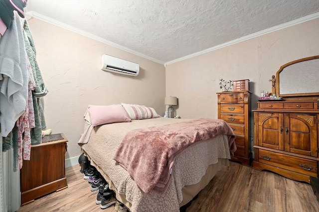 24 Hobson St, Brockton, MA 02302 - bedroom featuring a wall mounted air conditioner, wood finished floors, a textured ceiling, and crown molding