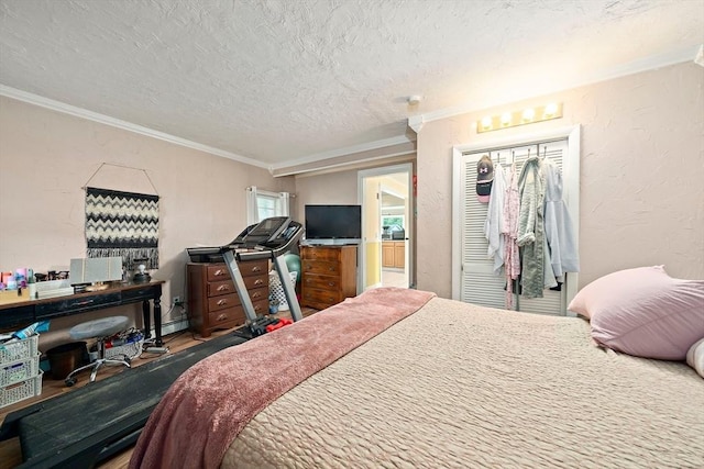 24 Hobson St, Brockton, MA 02302 - bedroom featuring ornamental molding, a textured ceiling, and a closet