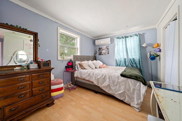 24 Hobson St, Brockton, MA 02302 - bedroom with light wood finished floors, a wall mounted air conditioner, and ornamental molding