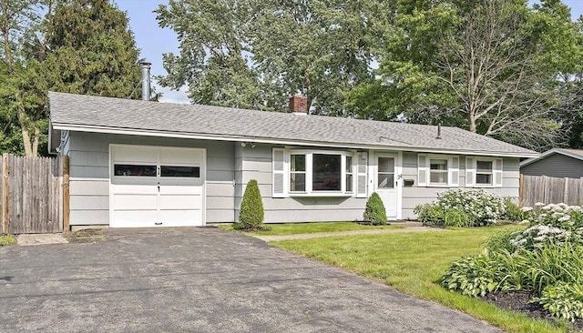 24 Hobson St, Brockton, MA 02302 - ranch-style home featuring a chimney, a garage, driveway, and a shingled roof
