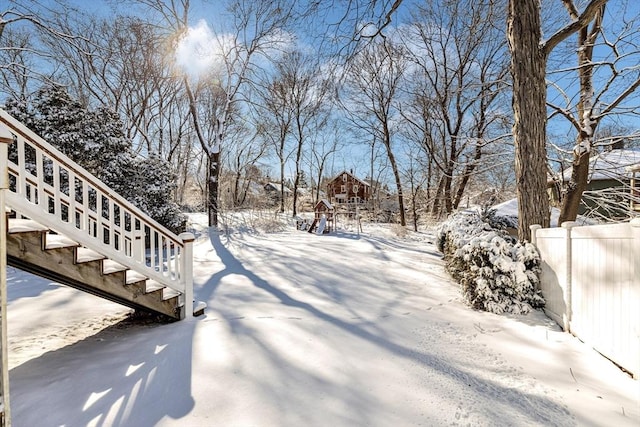 view of yard layered in snow