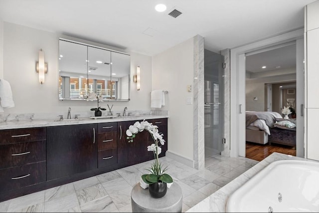 4 Battery Wharf Unit 4504, Boston, MA 02109 - full bathroom with connected bathroom, vanity, a whirlpool tub, recessed lighting, and marble look tiles