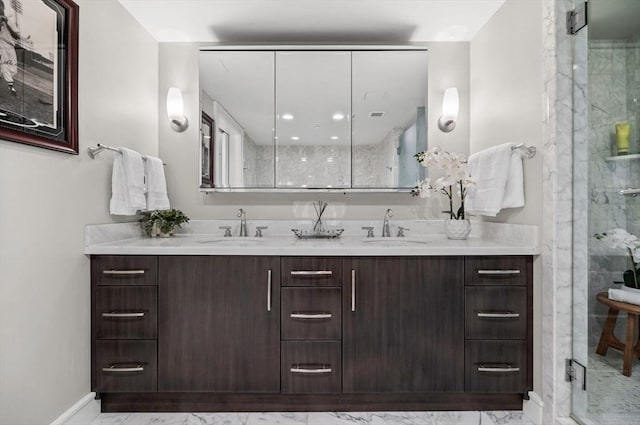 4 Battery Wharf Unit 4504, Boston, MA 02109 - full bathroom with double vanity, marble look tile flooring, and a marble finish shower