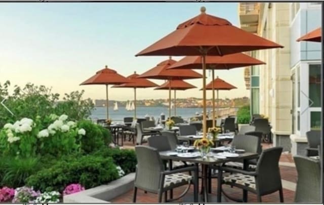 4 Battery Wharf Unit 4504, Boston, MA 02109 - view of patio / terrace with a water view and outdoor dining area