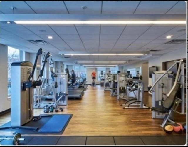 4 Battery Wharf Unit 4504, Boston, MA 02109 - exercise room featuring tile patterned flooring