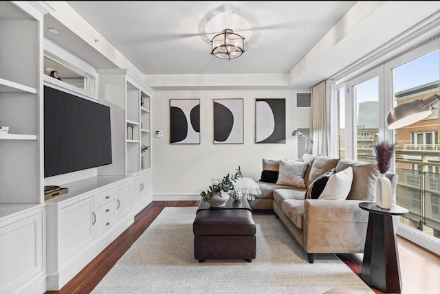 4 Battery Wharf Unit 4504, Boston, MA 02109 - living room with dark wood finished floors and built in shelves