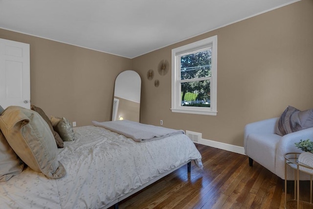 bedroom featuring dark hardwood / wood-style flooring