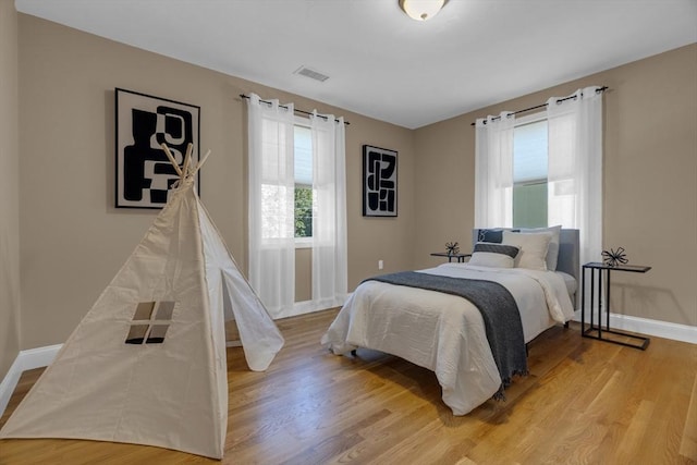 bedroom with light hardwood / wood-style flooring