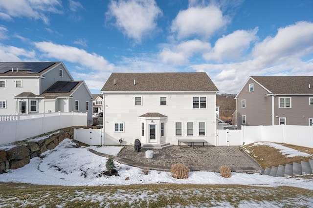 view of snow covered house