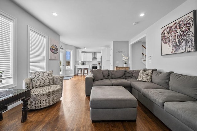 living room featuring dark wood-type flooring