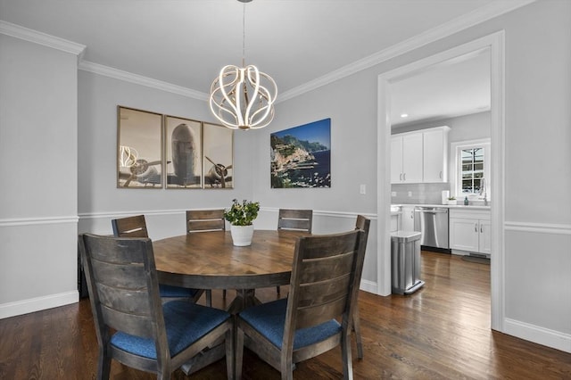 dining room with an inviting chandelier, dark hardwood / wood-style floors, and crown molding