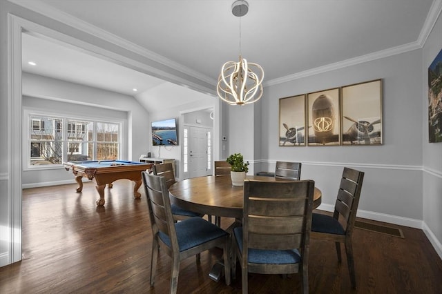 dining area with ornamental molding, dark hardwood / wood-style flooring, and a chandelier