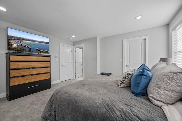 bedroom featuring light colored carpet