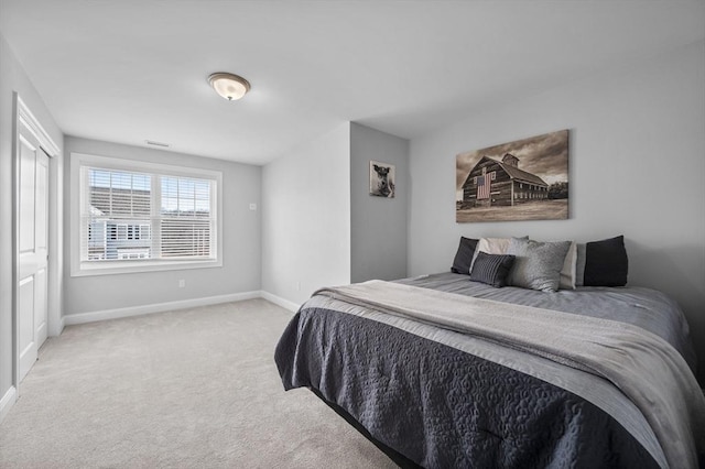 bedroom featuring light colored carpet