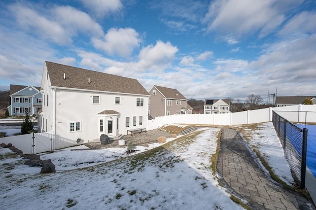 view of snow covered house