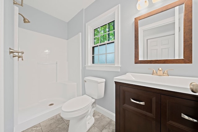 bathroom featuring toilet, a shower, vanity, and tile patterned floors