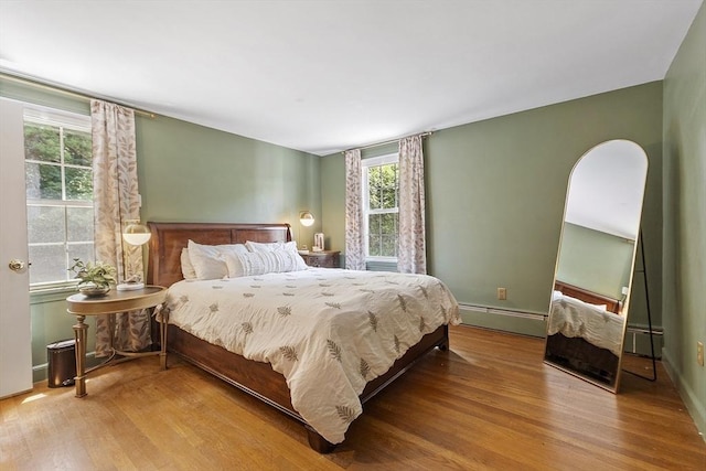 30 Brigham St, Hudson, MA 01749 - bedroom featuring a baseboard radiator and wood finished floors