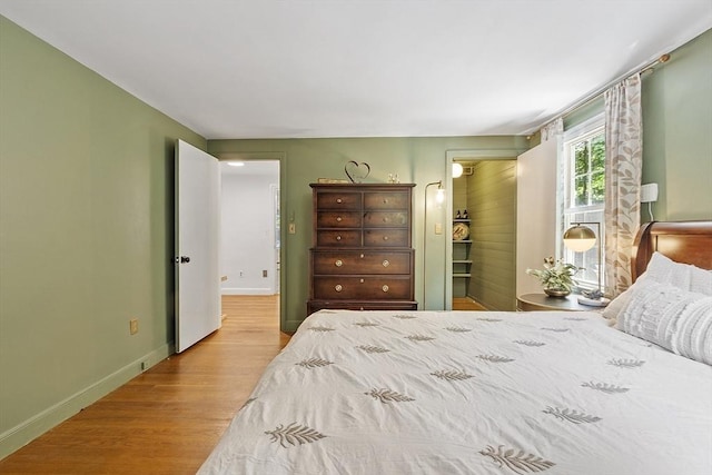 30 Brigham St, Hudson, MA 01749 - bedroom with light wood-type flooring and baseboards