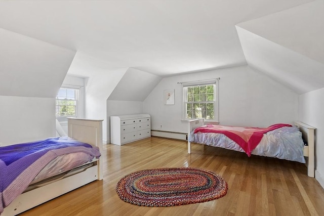 30 Brigham St, Hudson, MA 01749 - bedroom featuring a baseboard radiator, lofted ceiling, multiple windows, and wood finished floors