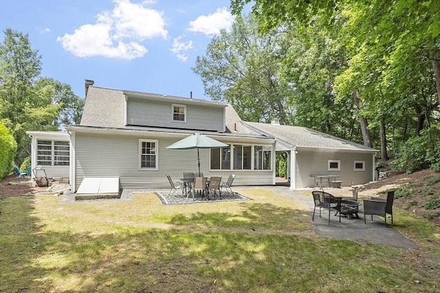 30 Brigham St, Hudson, MA 01749 - back of house featuring a sunroom, a patio, a lawn, and a fire pit