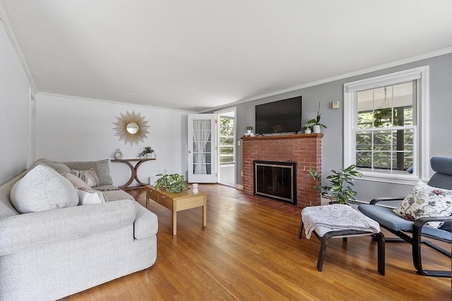 30 Brigham St, Hudson, MA 01749 - living area with wood finished floors, plenty of natural light, crown molding, and a brick fireplace