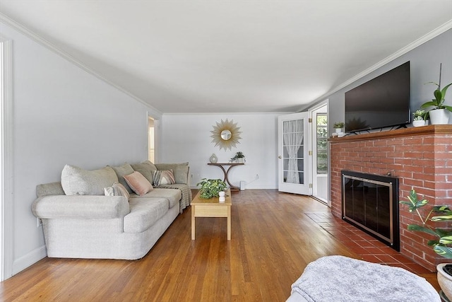 30 Brigham St, Hudson, MA 01749 - living area featuring ornamental molding, wood finished floors, and a brick fireplace