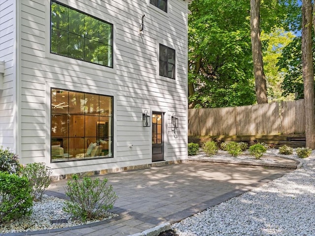 8 Wiswall Unit 8, Wellesley, MA 02482 - back of house with a patio area and fence