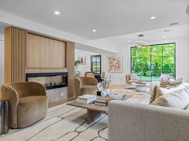 8 Wiswall Unit 8, Wellesley, MA 02482 - living area with recessed lighting, a fireplace, light wood-style flooring, and baseboards