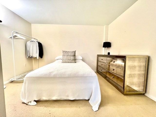2 Earhart Unit 121, Cambridge, MA 02141 - carpeted bedroom featuring baseboards