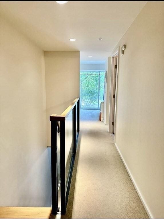 2 Earhart Unit 121, Cambridge, MA 02141 - hall featuring an upstairs landing, carpet flooring, baseboards, and recessed lighting