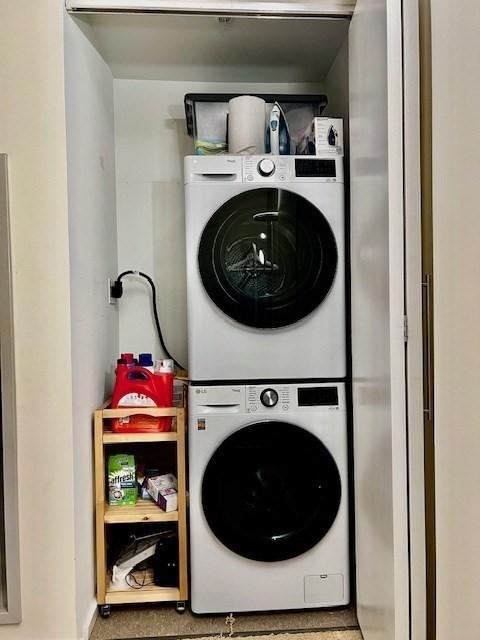 2 Earhart Unit 121, Cambridge, MA 02141 - laundry area with stacked washing machine and dryer