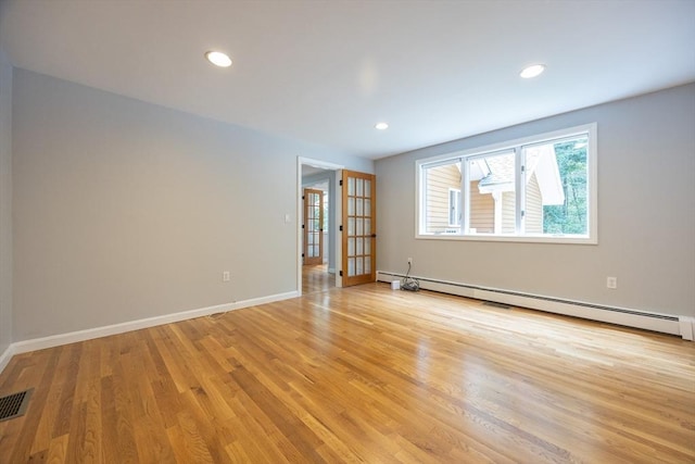 56 Burt St, Norton, MA 02766 - unfurnished room with baseboard heating, light wood-style flooring, and recessed lighting
