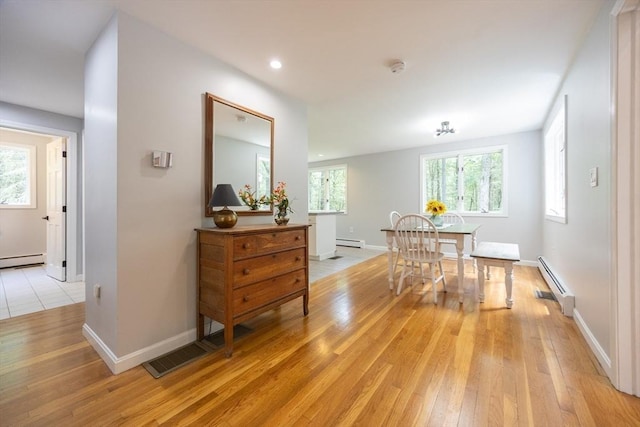 56 Burt St, Norton, MA 02766 - dining area with a baseboard radiator, baseboard heating, light wood finished floors, and recessed lighting