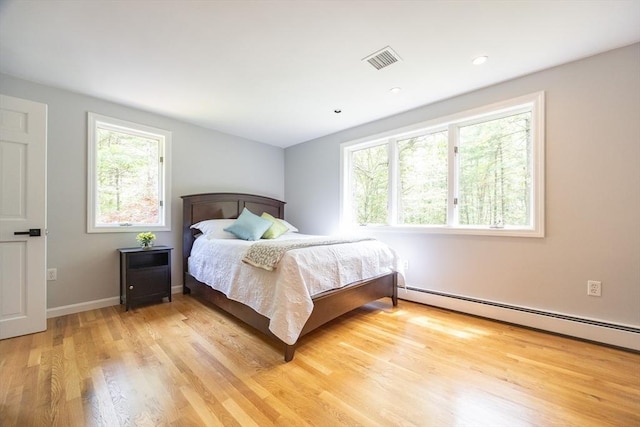 56 Burt St, Norton, MA 02766 - bedroom featuring baseboard heating, multiple windows, light wood-style flooring, and recessed lighting
