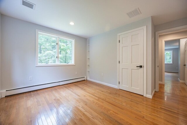 56 Burt St, Norton, MA 02766 - unfurnished bedroom with a baseboard radiator, light wood-style floors, and recessed lighting
